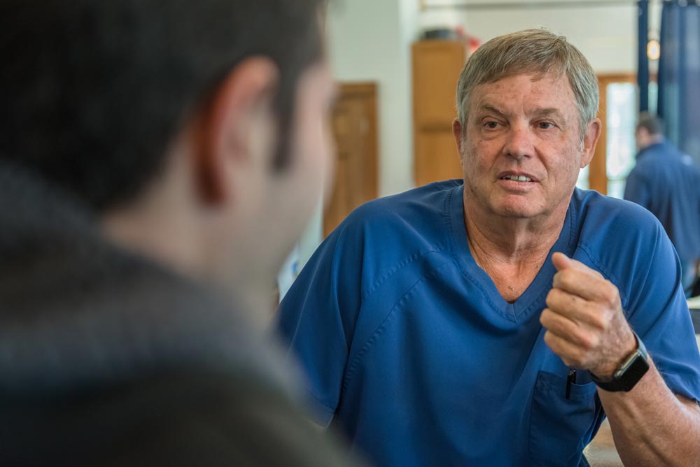 Doctor discusses treatment with patient