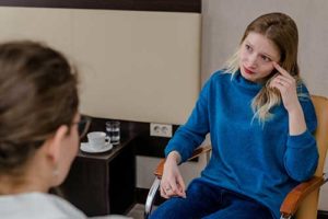 A woman and her therapist discuss NAD amphetamine abuse treatment in springfield la