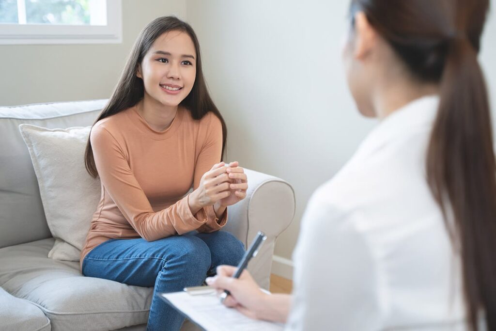 person with counselor discussing treatment options for anxiety