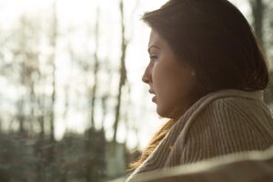 person looking out window with a concerned look on face wondering about ways to detox from benzos
