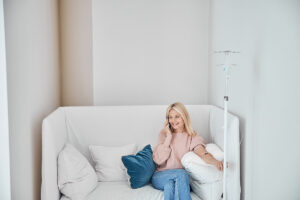person sitting on comfortable couch after starting NAD detox